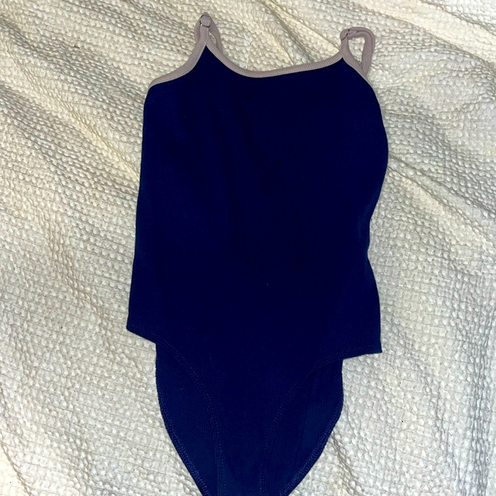 Women’s body suit, blue and white, adjustable straps, buttons.